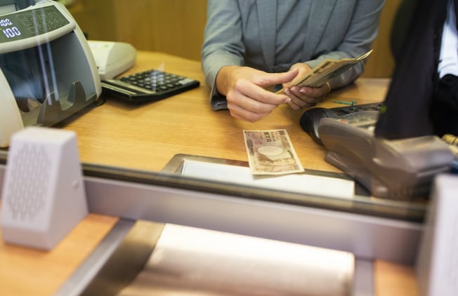 clerk-counting-cash-money-at-bank-office